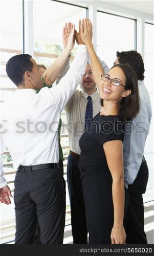 Business Team Giving One Another High Five