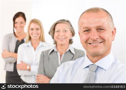 Business team happy mature man with colleagues standing in line