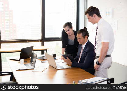 Business team having a meeting using laptop during a meeting and presents.