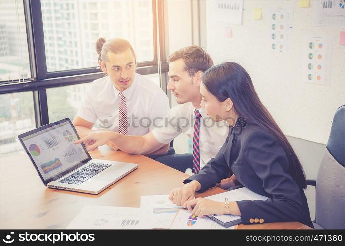 Business team having a meeting using laptop during a meeting and presents profit, Present report analysis and planning with brainstorm in teamwork.