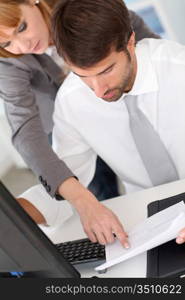 Business team in office working on desktop computer