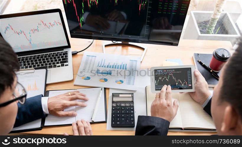 Business Team Investment Entrepreneur Trading discussing and analysis data the stock market charts and graphs negotiation and research budget, teamwork traders