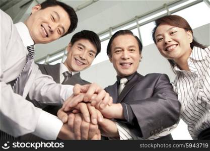 Business Team Making a Hand Pile