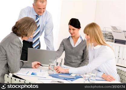 Business team meeting people around table brainstorming in office