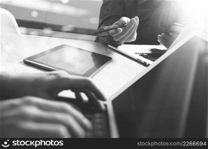 Business team meeting present. Photo professional investor working with new startup project , black white.Digital tablet laptop computer design smart phone using, keyboard docking screen foreground