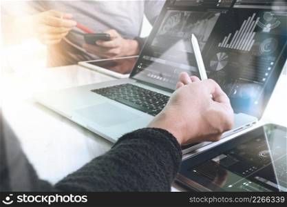 Business team meeting present. Photo professional investor working with new startup project. Finance managers meeting.Digital tablet laptop computer design smart phone using.Sun flare effect  