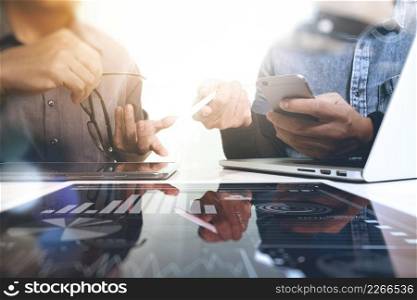 Business team meeting present. Photo professional investor working with new startup project. Finance managers meeting.Digital tablet laptop computer design smart phone using. Blurred background, Sun flare effect,Horizontal 
