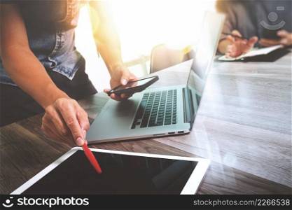 Business team meeting present. Photo professional investor working with new startup project. Finance managers meeting.Digital tablet laptop computer design smart phone using. Blurred background, Sun flare effect,Horizontal 