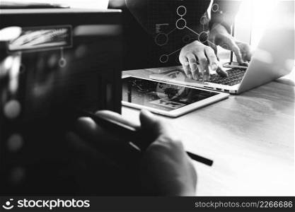 Business team meeting present. Photo professional investor working with new startup project. Finance managers meeting.Digital tablet laptop computer design smart phone using, compact server foreground, black white