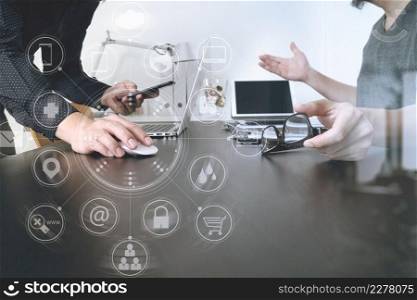Business team meeting.Professional investor working new start up project and digital tablet docking keyboard and laptop computer with smart phone using and eyeglasses in modern office with virtual interface graphic icons network diagram