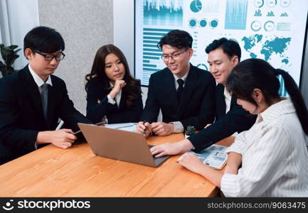 Business team of financial data analysis meeting with business intelligence, report paper and dashboard on laptop for marketing strategy. Business people working together to promote harmony in office.. Business team of financial data analysis meeting report paper in harmony office.