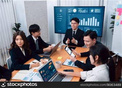 Business team of financial data analysis meeting with business intelligence, report paper and dashboard on laptop for marketing strategy. Business people working together to promote harmony in office.. Business team of financial data analysis meeting report paper in harmony office.