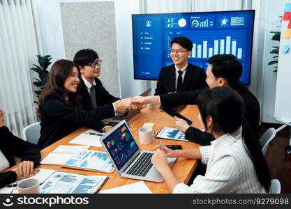 Business team of financial data analysis meeting with business intelligence, report paper and dashboard on laptop for marketing strategy. Business people working together to promote harmony in office.. Business team of financial data analysis meeting report paper in harmony office.