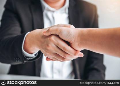 Business team shaking hands during a meeting Planning Strategy Analysis Concept