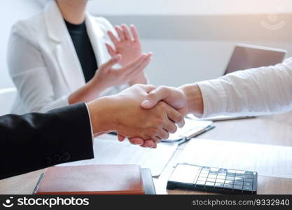 Business team shaking hands during a meeting Planning Strategy Analysis Concept