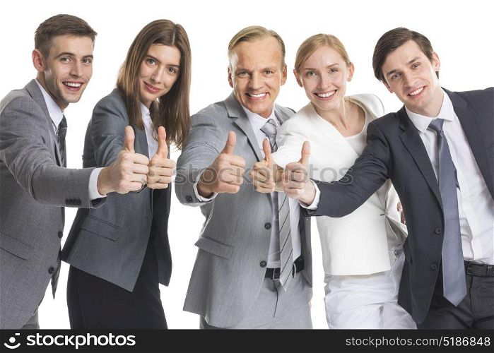 Business team showing thumb up. Business team showing thumb up isolated on white background