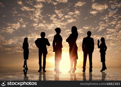 Business team. Silhouettes of business people standing in line