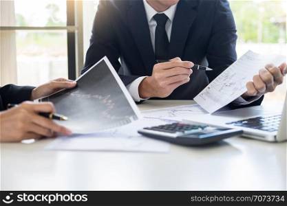 Business Team trader or broker Investment Entrepreneur colleagues working discussing and analysis graph stock market trading with forex chart data, financial, selling and buying concept.