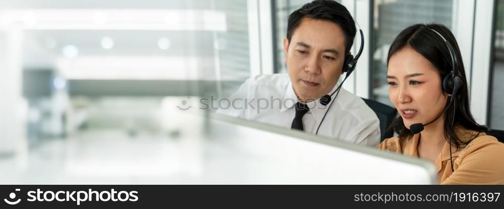 Business team wearing headset working actively in office . Call center, telemarketing, customer support agent provide service on telephone video conference call.. C2-C3
