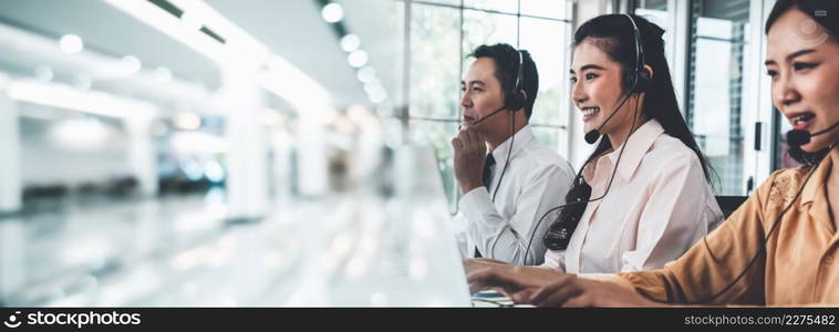 Business team wearing headset working actively in office . Call center, telemarketing, customer support agent provide service on telephone video conference call.. Business team wearing headset working actively in office