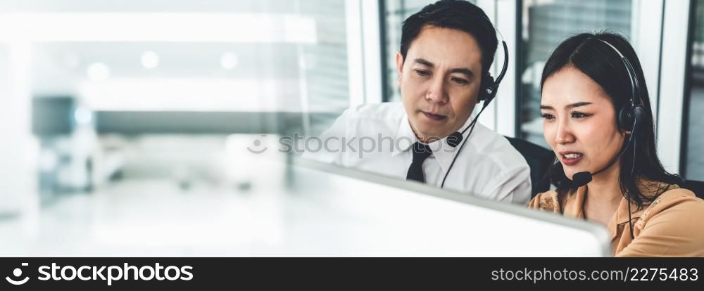 Business team wearing headset working actively in office . Call center, telemarketing, customer support agent provide service on telephone video conference call.. Business team wearing headset working actively in office