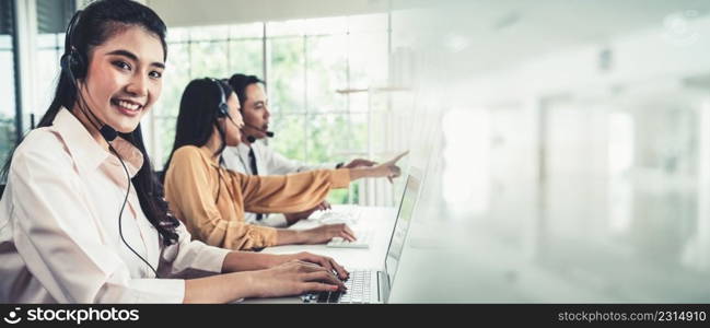 Business team wearing headset working actively in office . Call center, telemarketing, customer support agent provide service on telephone video conference call.. Business team wearing headset working actively in office