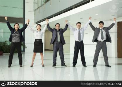 Business Team with Arms Raised