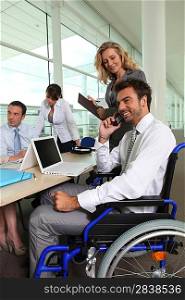 business team with colleague in wheelchair