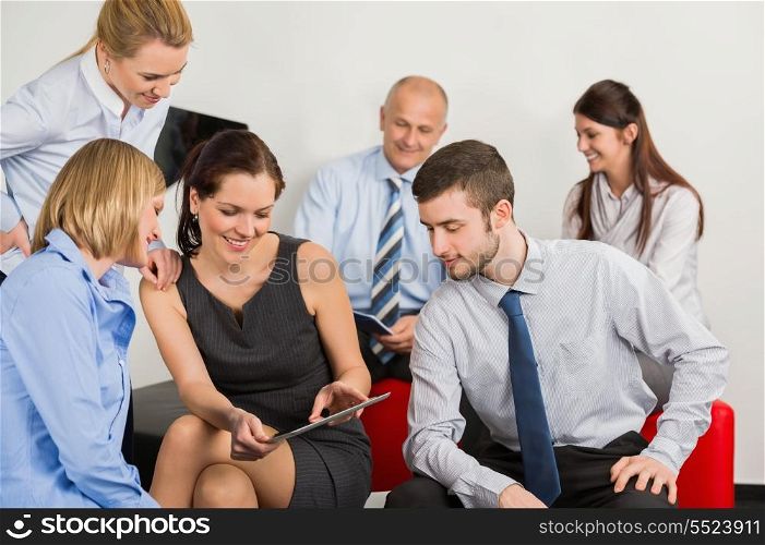 Business team with digital tablet discussing in office