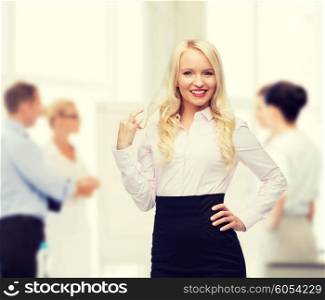 business, team work and people concept - smiling businesswoman, student or secretary over group of colleagues in office background