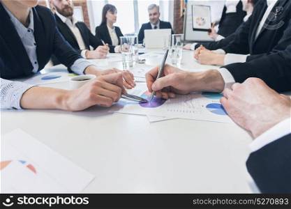 Business team work with reports. Business team at meeting working with financial reports