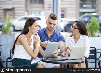 Business team working at laptop in a office outdoor