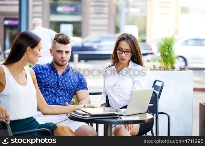 Business team working at laptop in a office outdoor