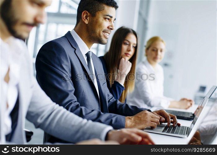 Business team working together in modern office to achieve better results