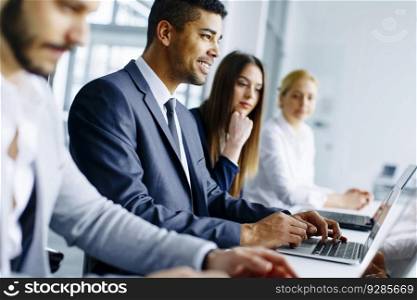 Business team working together in modern office to achieve better results