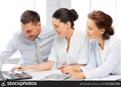 business team working with tablet pc and laptop in office
