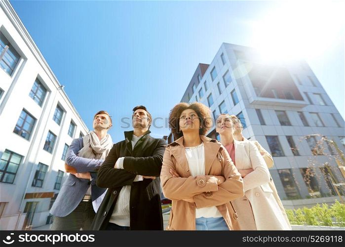 business, teamwork and leadership concept - international group of people on city street. international group of people on city street