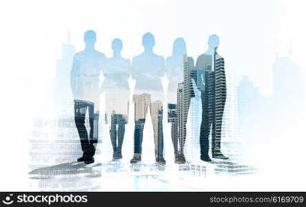 business, teamwork and people concept - business people silhouettes over city background with double exposure effect