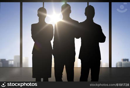 business, teamwork and people concept - business people silhouettes over office background