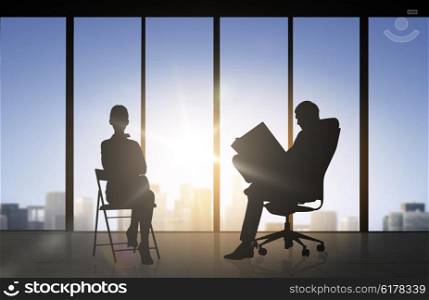 business, teamwork and people concept - silhouette of people working over office window background