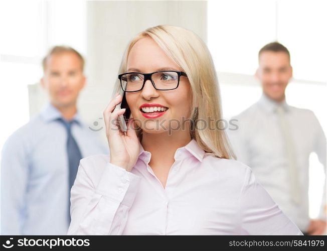 business, teamwork and people concept - smiling businesswoman, student or secretary in eyeglasses calling on smartphone over office and group of colleagues background