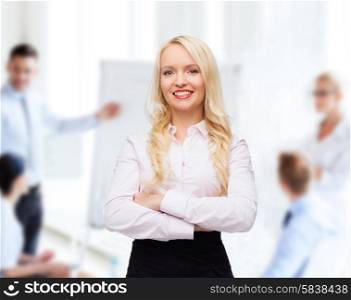 business, teamwork and people concept - smiling businesswoman, student or secretary over office and group of colleagues background
