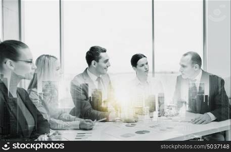 business, teamwork and people concept - team at office meeting over city buildings and double exposure effect. smiling business team at office meeting