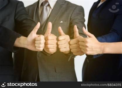 business teamwork show hands with thumb up, very good, successful concept, soft light effect