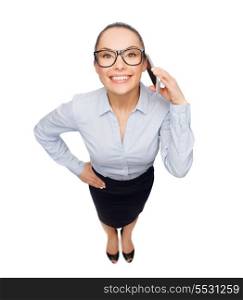 business, technilogy, communication and office concept - smiling businesswoman in eyeglasses with smartphone