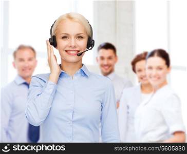 business, technology and call center concept - friendly female helpline operator with headphones