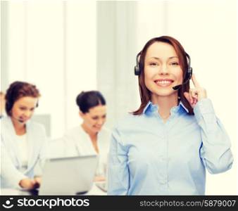 business, technology and call center concept - friendly female helpline operator with headphones at office