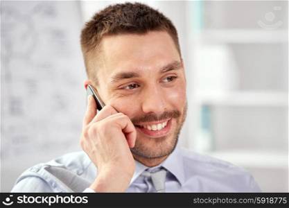 business, technology and communication concept - young smiling businessman calling on smartphone