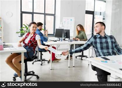 business, technology and creative people concept - designers with user interface mockup at office. creative office workers with user interface mockup. creative office workers with user interface mockup
