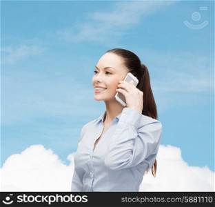 business, technology and education concept - friendly young smiling businesswoman with smartphone